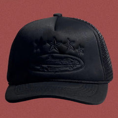 Corteiz All-Black Trucker Hat with Tonal Stars and Cruise Ship Graphic